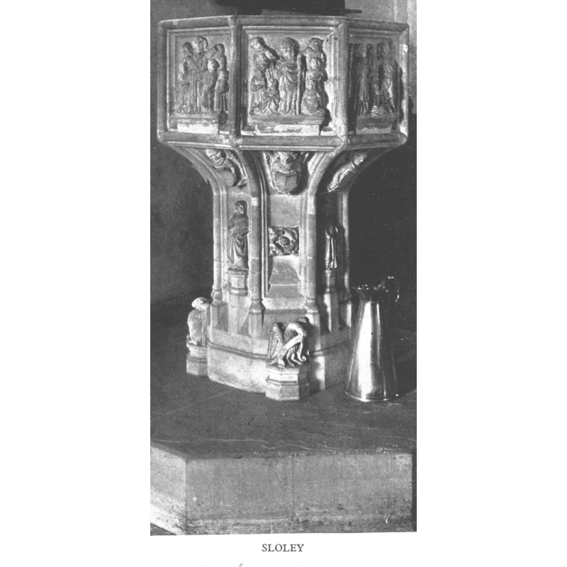 one on every other side of the pedestal base, alternating with standing figures on the other four sides