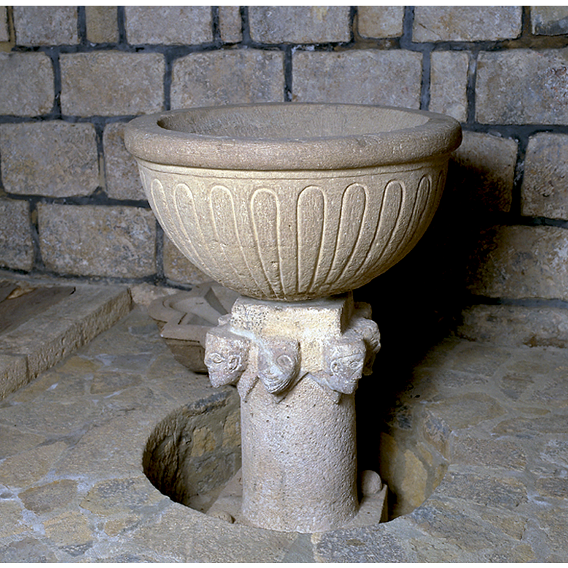 one at each angle of the square lower base -- two of them are visible in the image here, the others hidden in the raised flooring