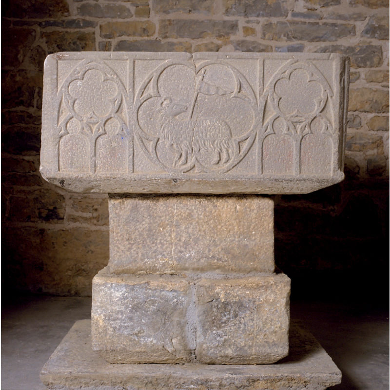 on the basin side to the right of the Agnus Dei