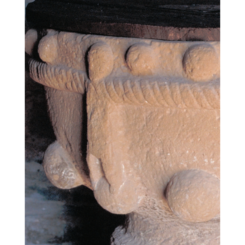 row of balls separated by the vertical mouldings, as well as forming a sketchy human being linking its arms with the next at both sides