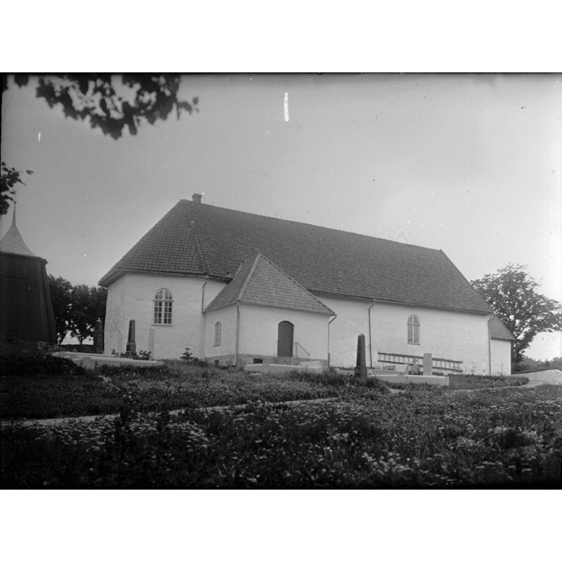the detached bell-cote partially visible on the left