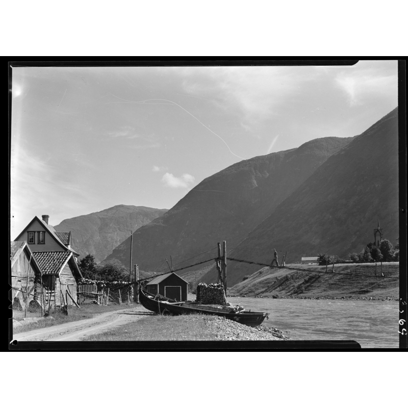 the 1867 church on a promontory, across the water, right side of the image