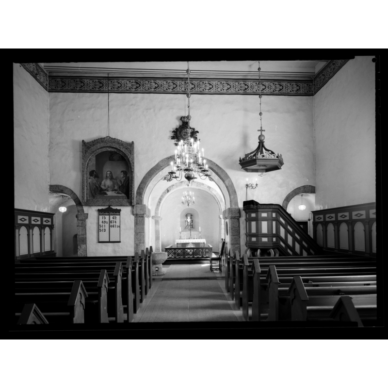 showing the old font at the east end of the nave, north side of the centre aisle