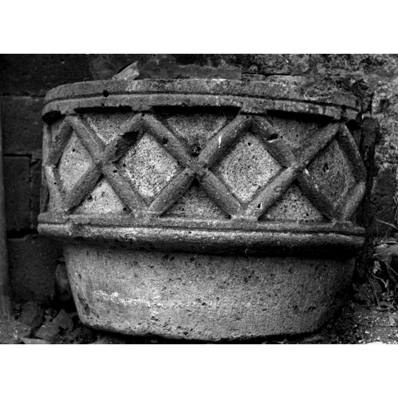 the Mémoire [AP63W00805] source does not unfortunately give a date of the photograph, but it was taken when the font was still partly built into a wall, which may account for the damage done to the font [unless the damage had occurred earlier and the 'bad' side was thus hidden from view]