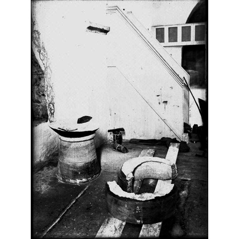 the font as shown in 1931, during its restoration -- Source caption: "Dopfunt av kalksten. Senmedeltida. Locket från 1600-talet, "torn" på medeltida lockbotten. Under restaurering."