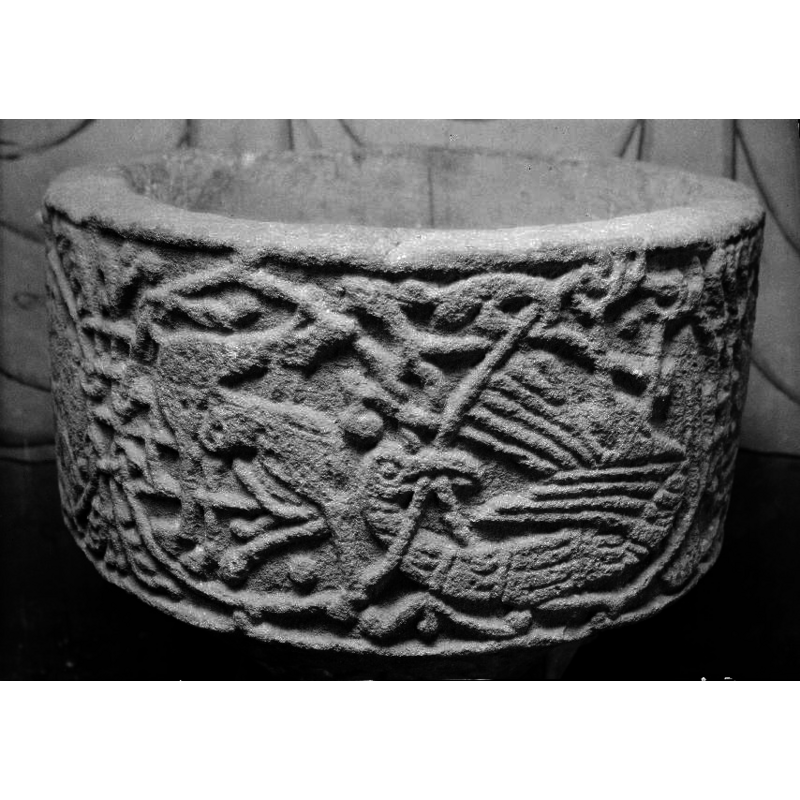 Winged animal, on its back, wings and legs upward. Eagle? [seen here on the right side of the image]