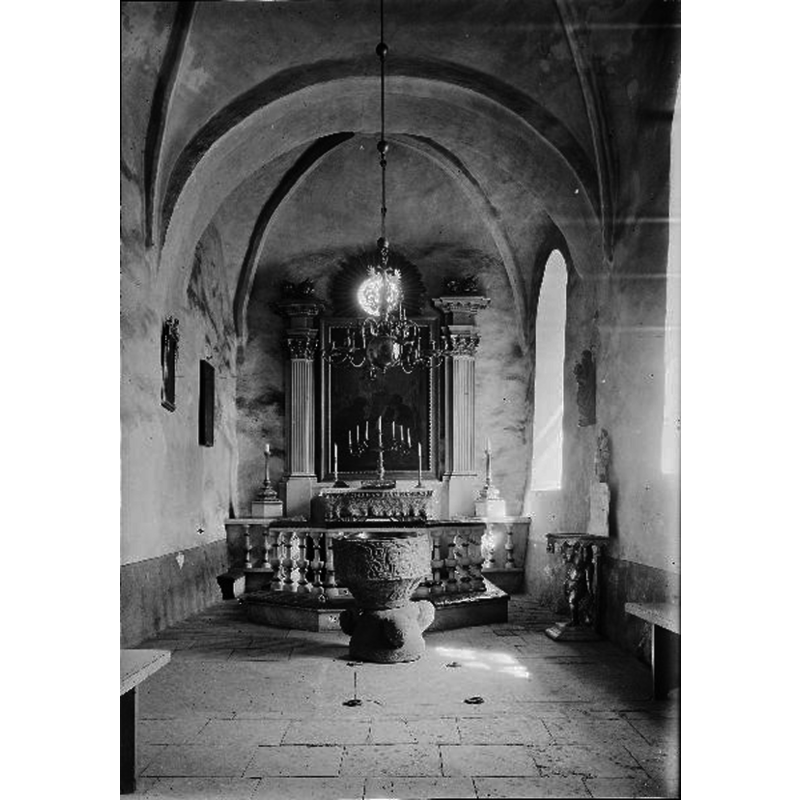 at the time -1922- the font was located in the centre aislejust west of the communion railing