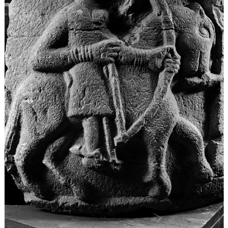 this is part of a battle scene between two mounted warriors; the mounted archer seen here battles a warrior on foot armed with shield and sword