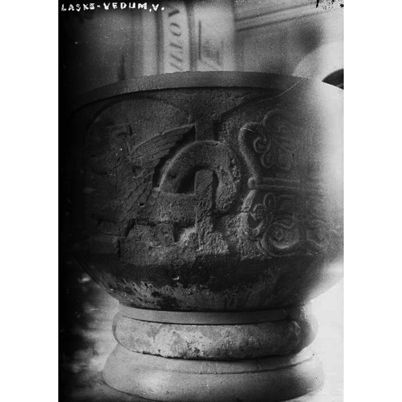 on the left is a partial view of the scene in which a mounted warrior fights a dragon, of which only the dragon is visible here -- in the right arch a palm-foliated cross