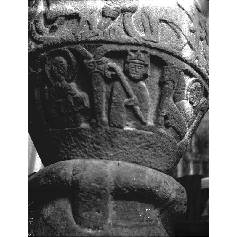 the mitre looking like a crown -- [L->R]: Christ in Majesty(?) - bishop(?) with staff - haloed angel with scroll -- notice the detail on the base, probably a head but now eroded into anonymity