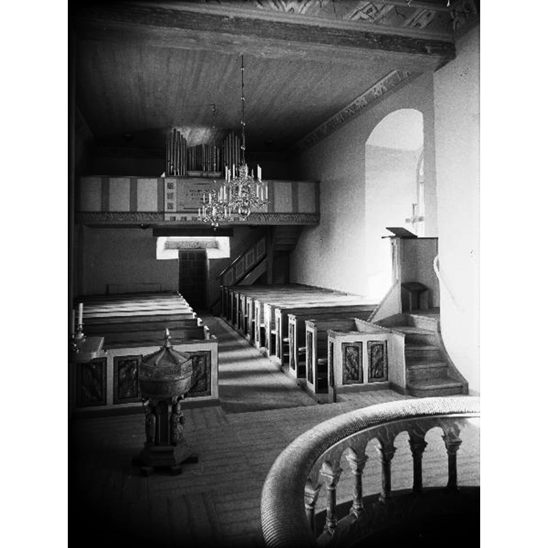 Source caption: "Interiör mot väster. Efter restaureringen."  Although the photograph is undated, it was likely taken in the late-1930s or later, as the font in the photograph was made in the 1930s by Gustav Berg, of nearby Rackey. The photographer, Karl Axel Forssén (1888-1961) was an architect involved in many church restorations.