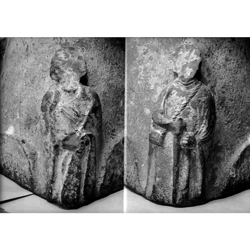 defaced bearded male on the left -- defaced figure on the right wears rectangular purse(?) on a long rope across the chest; a pilgrim?