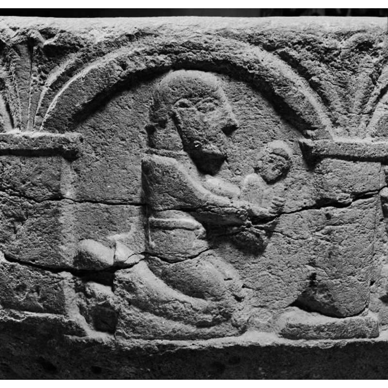 the kneeling male figure in this arch offers the soul to the Christ in Majesty in the next arch