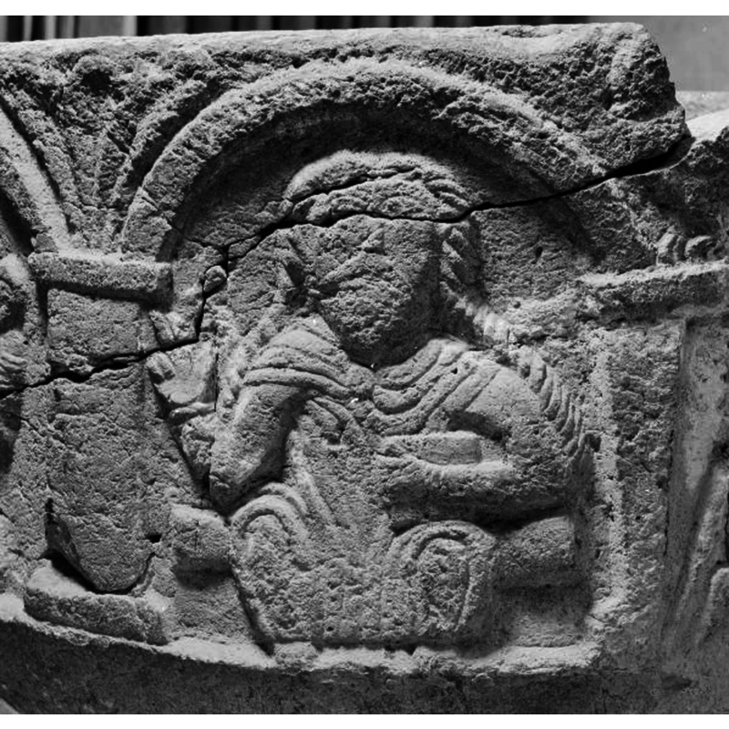 Christ in Majesty blesses the offering from the arch on the left