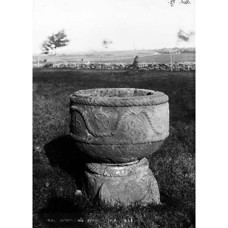 shown in a field or churchyard?