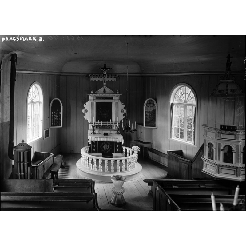 showing the mid-18thC font at the east end of the nave, centre aisle