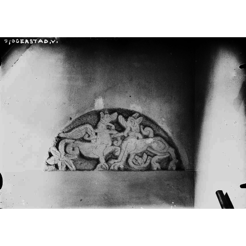 the former tympanum from the church at Rådene was installed as an ornament inside the new church at Sogerstad, on the south wall of the nave