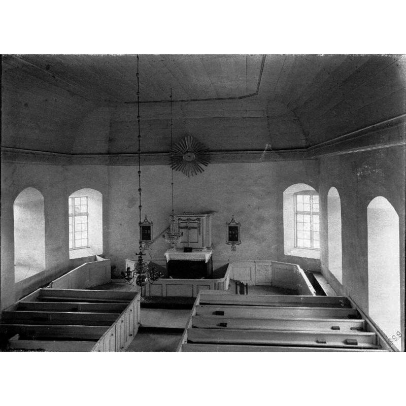 the photograph must have been taken shortly before the old church collapsed ca. 1900 -- if the medieval font was inside the church it may have been located at the west end at the time