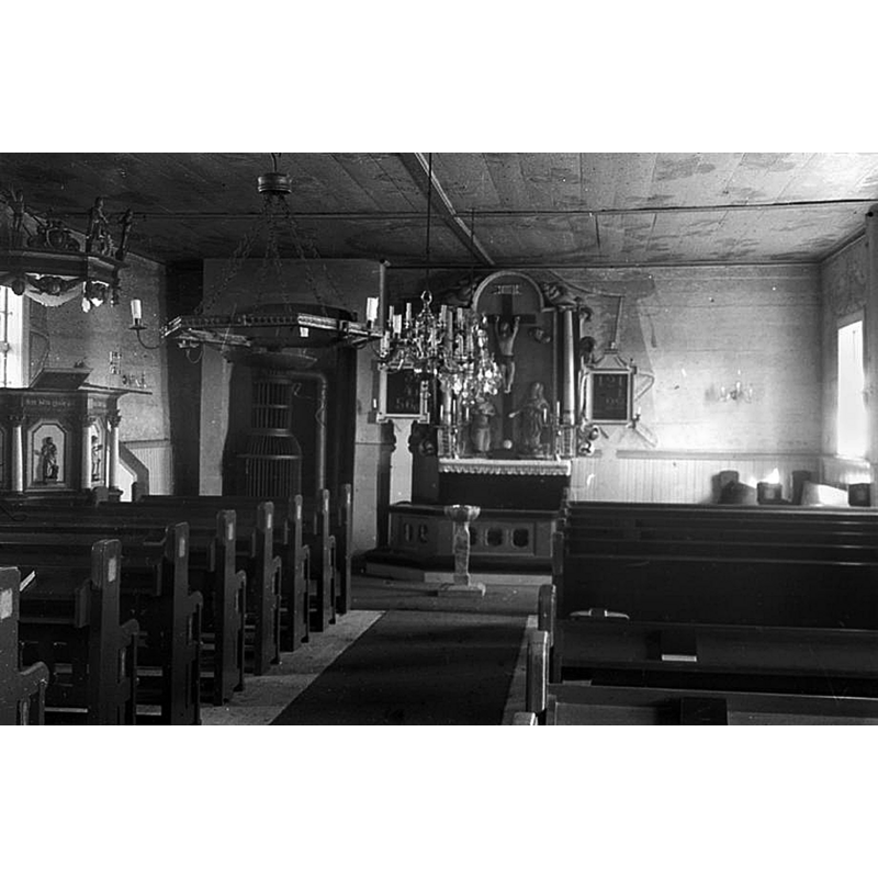the interior of the church as it was before the 1950s restoration -- notice the font in use and its location at the east end of the centre aisle