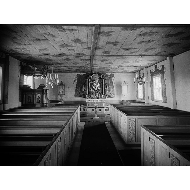 the interior of the church after the 1950s restoration -- notice the font in use and its location at the east end of the centre aisle