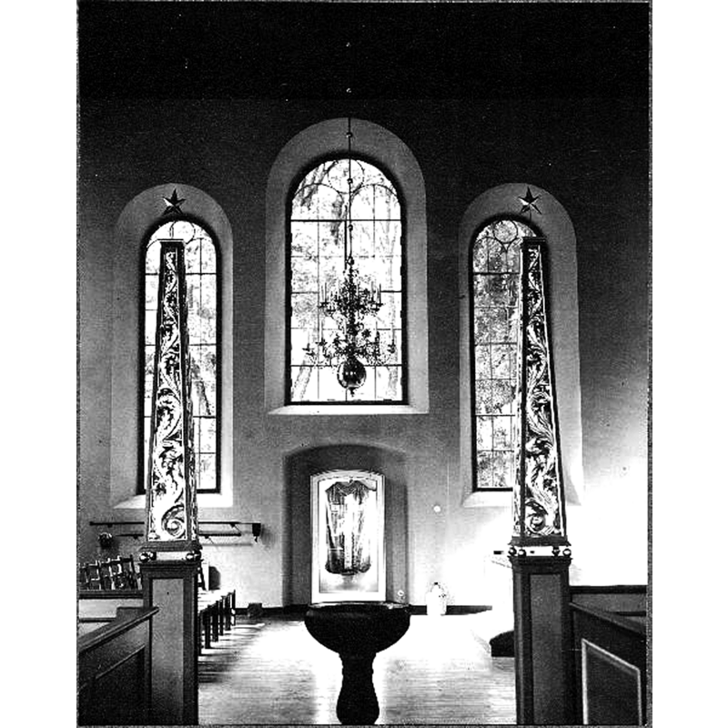 the later font seen here inside the church, looking north