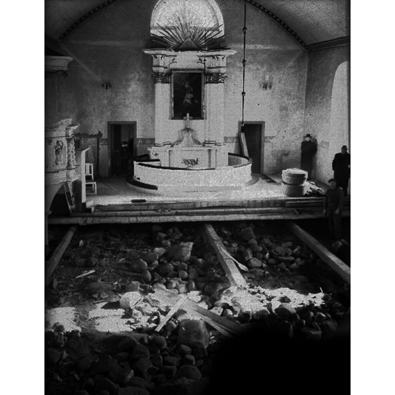 showing the interior of the church during the 1953 renovations; the font is clearly visible at the southeast corner of the nave