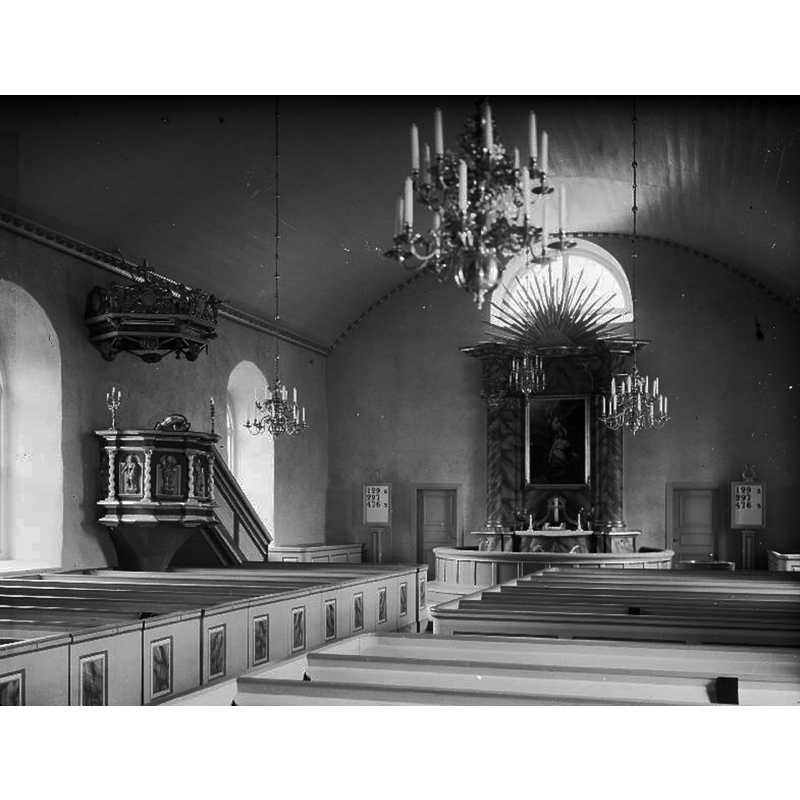 the interior after the 1953 restoration; the font is partially visible at the far [east] end, to the right [south] of the altar -- Source caption: "Interiör mot öster. Efter restaureringen 1953."