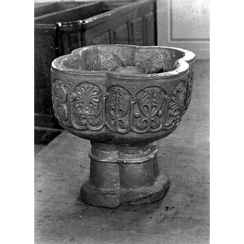 the font at the east end of the nave, south side