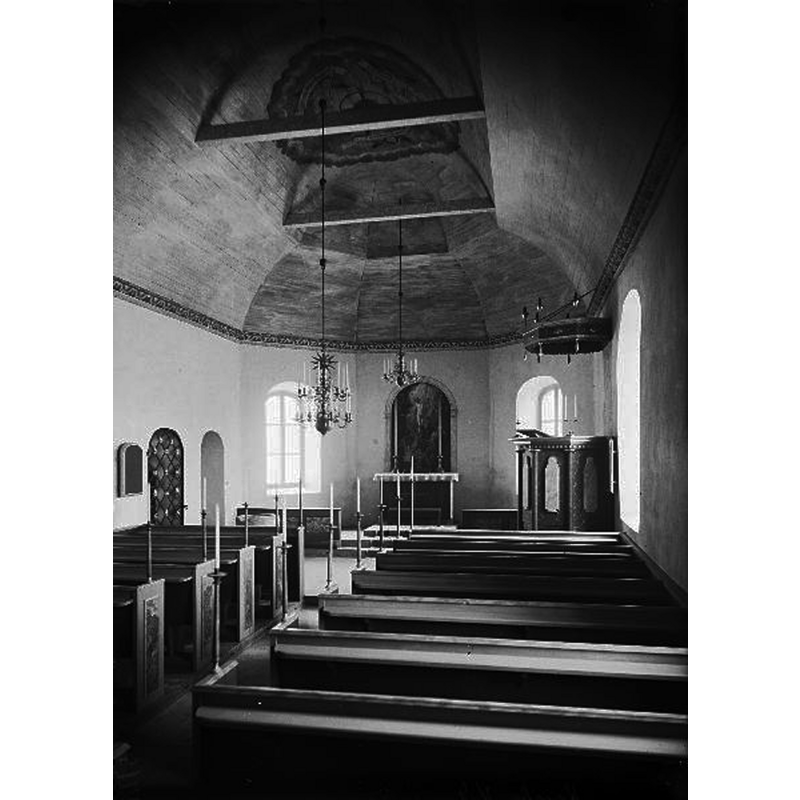 the interior of the church after the 1923 restoration -- the top of the medieval font is discernible att the back [east end], on the left [north] side, near the scaristy doorway
