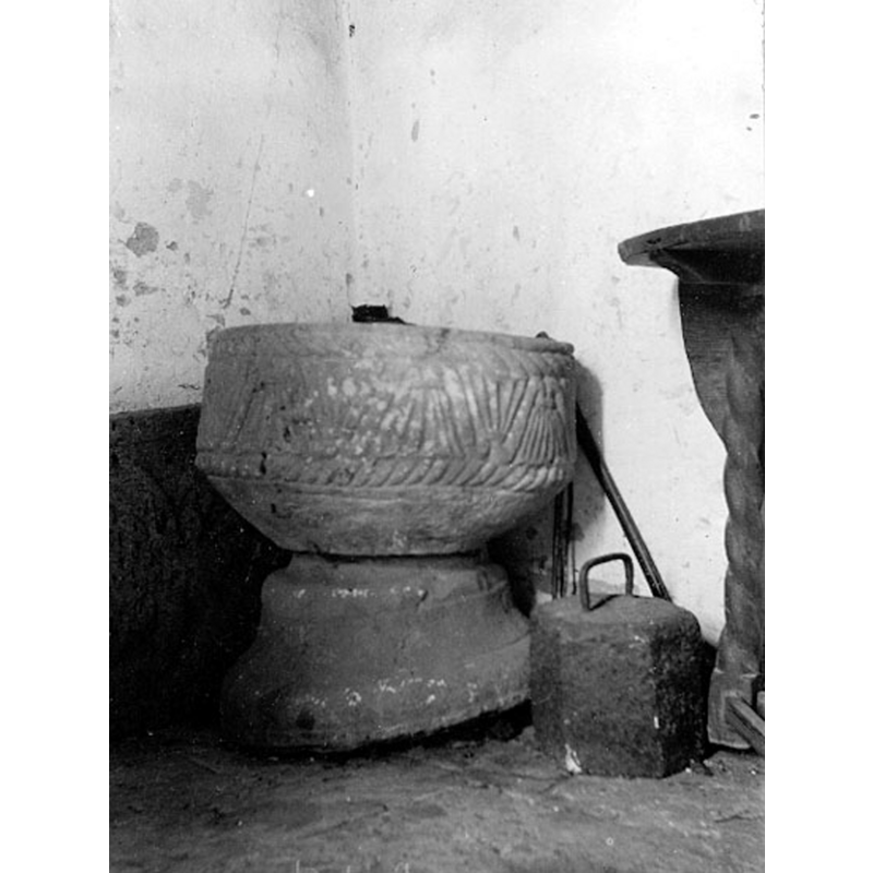 the medieval font in 1911, when it was not in use, after the introduction of the new wooden font ca. 1698