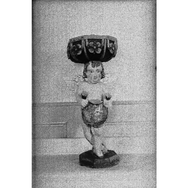 the 1693 wooden font -- Source caption: "Dopfunt, skulpterad i trä, oktogonal cuppa uppburen av putti, 1700-talet. Efter konservering."
