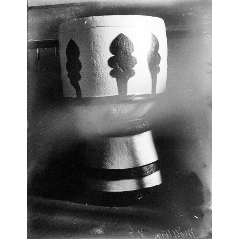 the painted medieval font; photograph taken before the 1938-1943 renovation, when the paint was removed