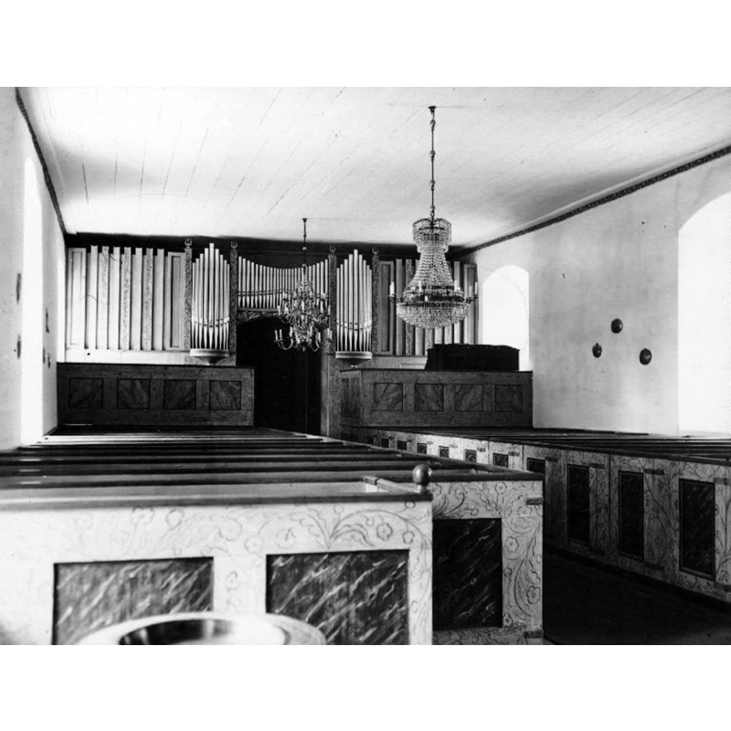 the top of the basin and the baptismal dish are partially visible here in the bottom-left corner