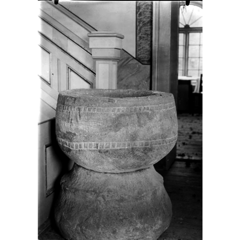 the stairs behind the font lead up to the pulpit