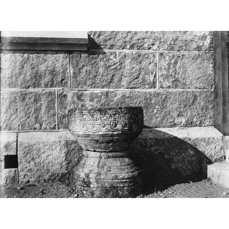 although the photograph is not dated it shows the font outside the church, so it may have been taken in the 1890s, the time when the olf church was demolished and the new one built