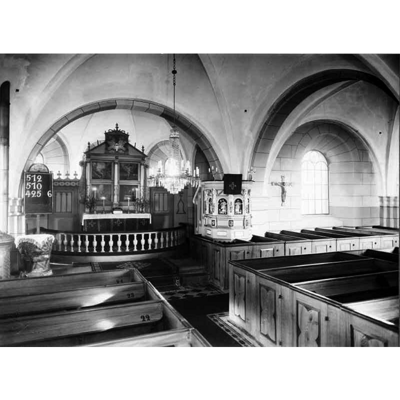 Source caption: "Glostorps kyrka [...] Interiör mot öster." -- notice the medieval font by the left [north] pillar of the chancel arch