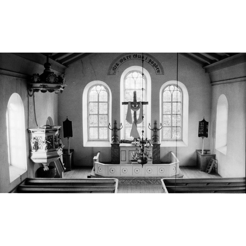 notice the medieval baptismal font semi-hidden beneath the pulpit, obviously unused at the time