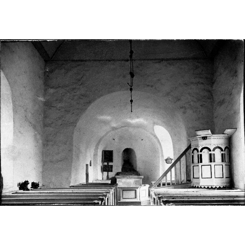 the interior of the old church photographed in 1893; the old church had been abandoned in 1885 in favour of its replacement church, but would be restored to regular use in the 1920s; the church would be renovated in 1949, when the medieval mural paintings of the interior were uncovered