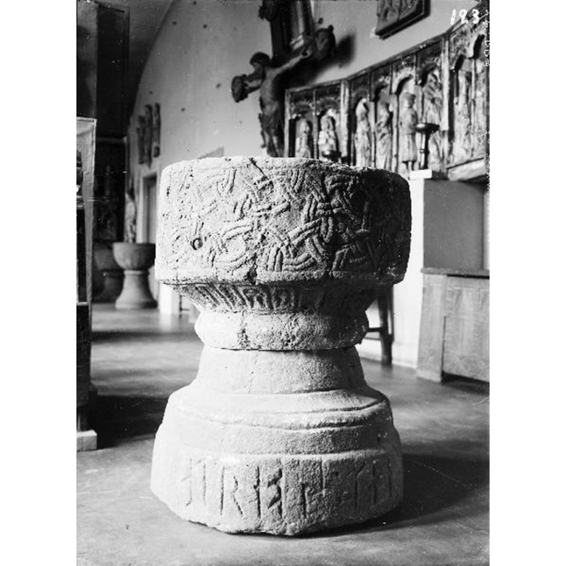 Source caption: "Finnekumla Kyrka [...] Dopfunt av sandsten, signerad Andreas, 1100-1249." -- it shows the font on display at the Göteborgs stadsmuseum, where the font resided between the date of its donation in 1876 and 1920, the year when it was returned to the church [cf. FontNotes]