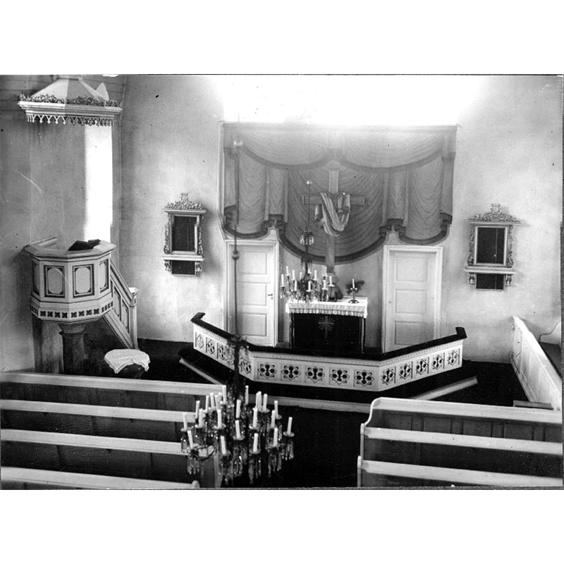 the interior of the new church; the medieval font is partially visible on the left, by the pulpit, covered with a white cloth; the undated photograph must have been taken after the 1952 renovation