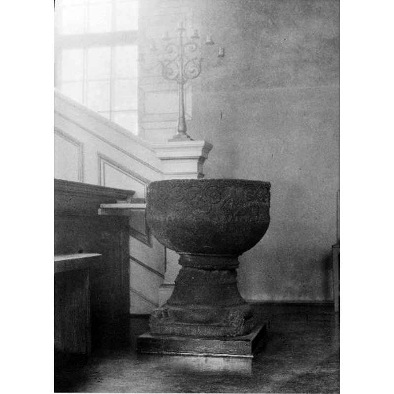 the medieval font originally from Skepplanda seen here in the northeast corner [pulpit side] of the parish church at Lödöse St Peder