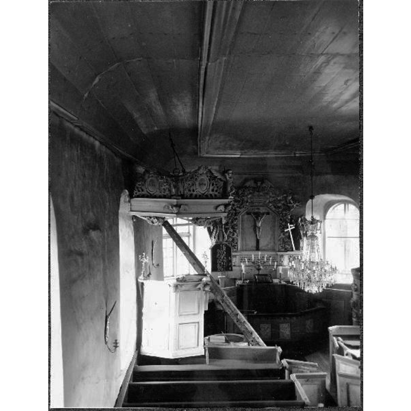 the medieval font is partially visible here by the right side of the pulpit base; the photograph is dated 1935, before the restoration of the church