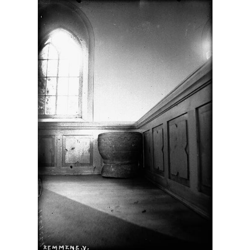the font in the interior of the church, seen here before the 1963 renovation