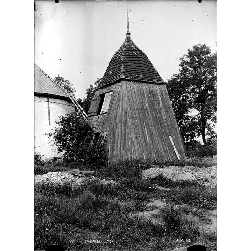 the church was re-built with an attached tower in 1915 but the old belfry was retained