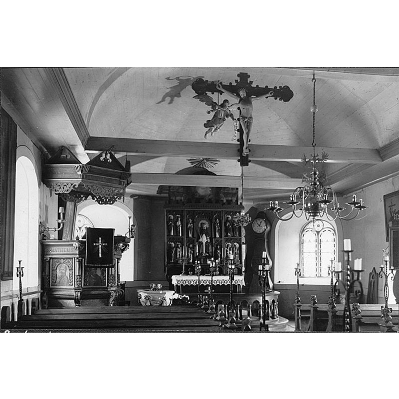 the 17thC baptismal font is partially visible here to the right of the pulpit