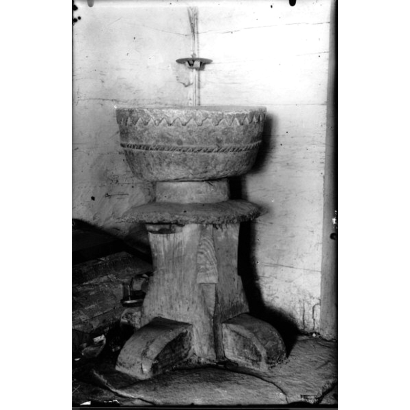 the soapstone basin is shown here raised on a makeshift wooden base; unfortunately the photograph is not dated
