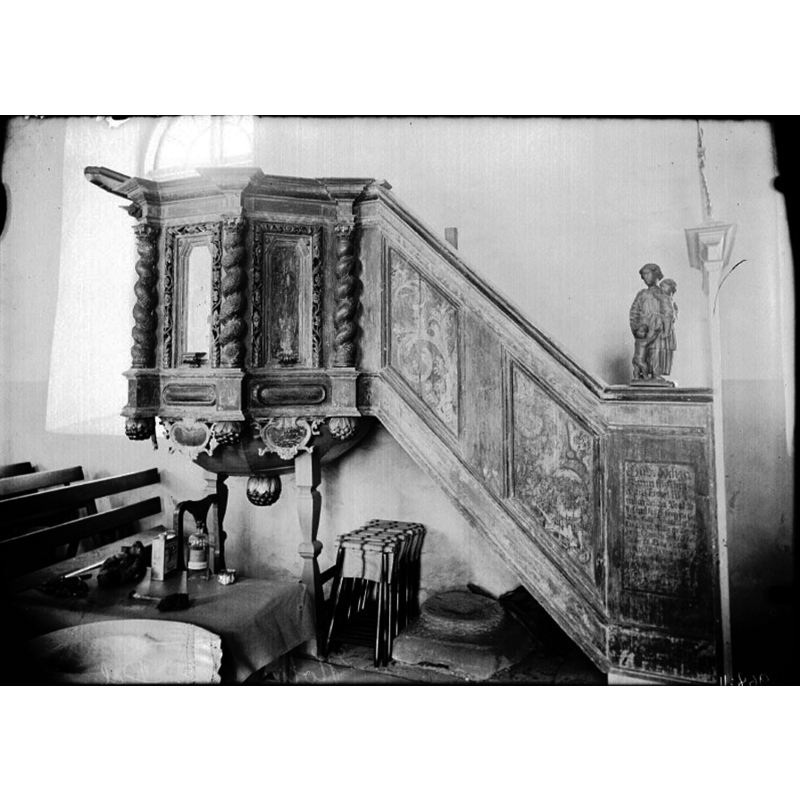 the medieval font in use is partially visible in the borrom-left corner; the fragment of another medieval font is located beneath the pulpit stairs [cf. Hallbäck (1959) in FontNotes] -- the photograph was taken right after the restoration led in 1927 by Axel Forssén, the architetct responsible