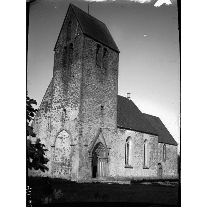 Source caption; "Hamra kyrka [...] Kyrkan från sydväst." -- showing the blocked original west portal of the tower