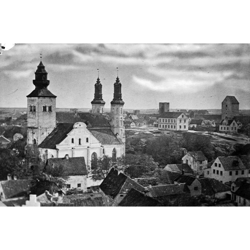 Source caption: "Visby Cathedral, Saint Mary, inaugurated in 1225. Originally built for German hanseatic traders and an episcopal church since 1572. Towers of the City Wall to the right in the picture. The photographer Olivia Wittberg (1844-1908) was from Gotland. Format: Albumen print"