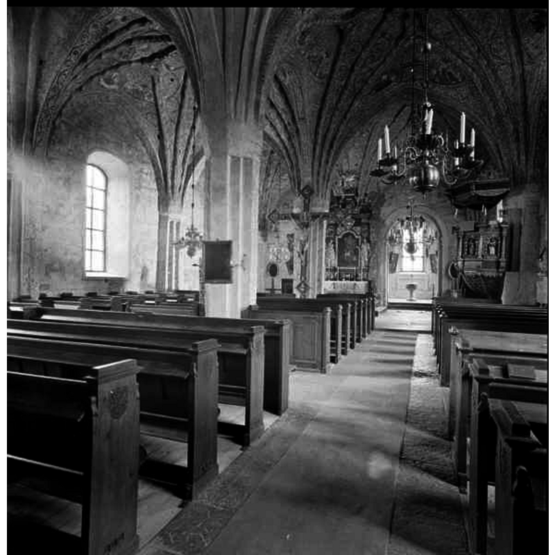showing the baptismal font  at the east end of the aisle